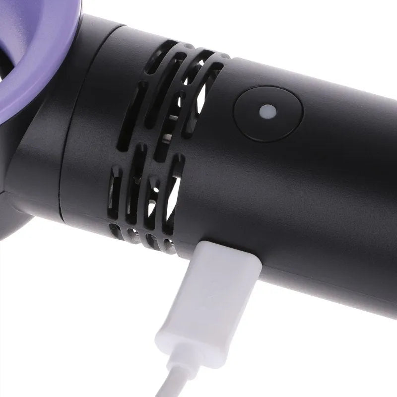 Compact portable bladeless fan in chosen colour on its base, with USB cable for charging.