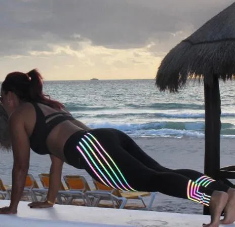 Women's black workout leggings with glow-in-the-dark print pattern for fitness activities
