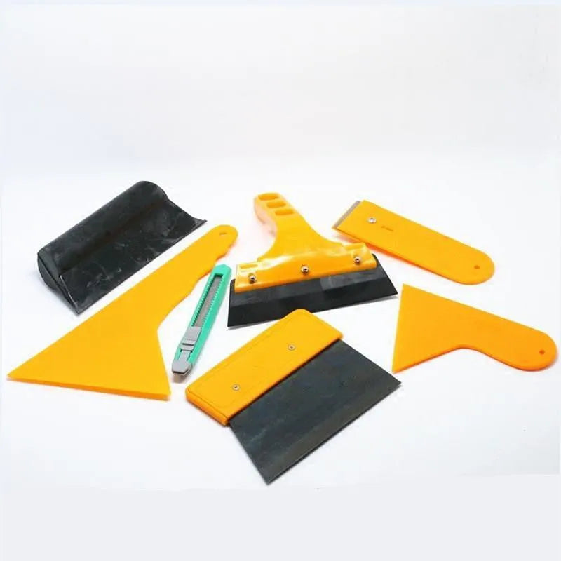 Seven-piece car film tool set with scrapers, knives, tendon scraper, and pressing block.