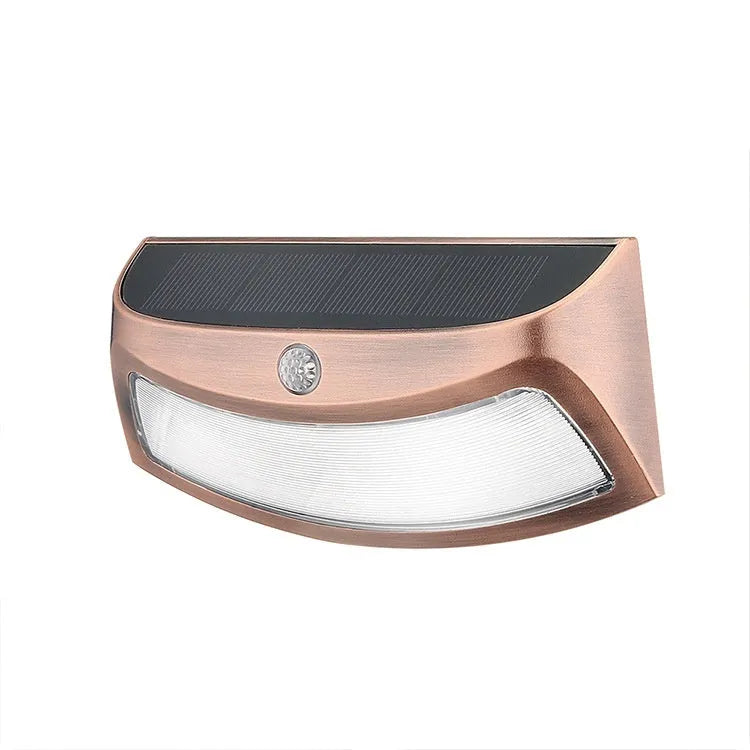 Solar outdoor wall lamp with smiling face design measuring 153mm by 76mm by 38mm