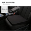 Black car seat cushion showing thickness and dimensions for height adjustment