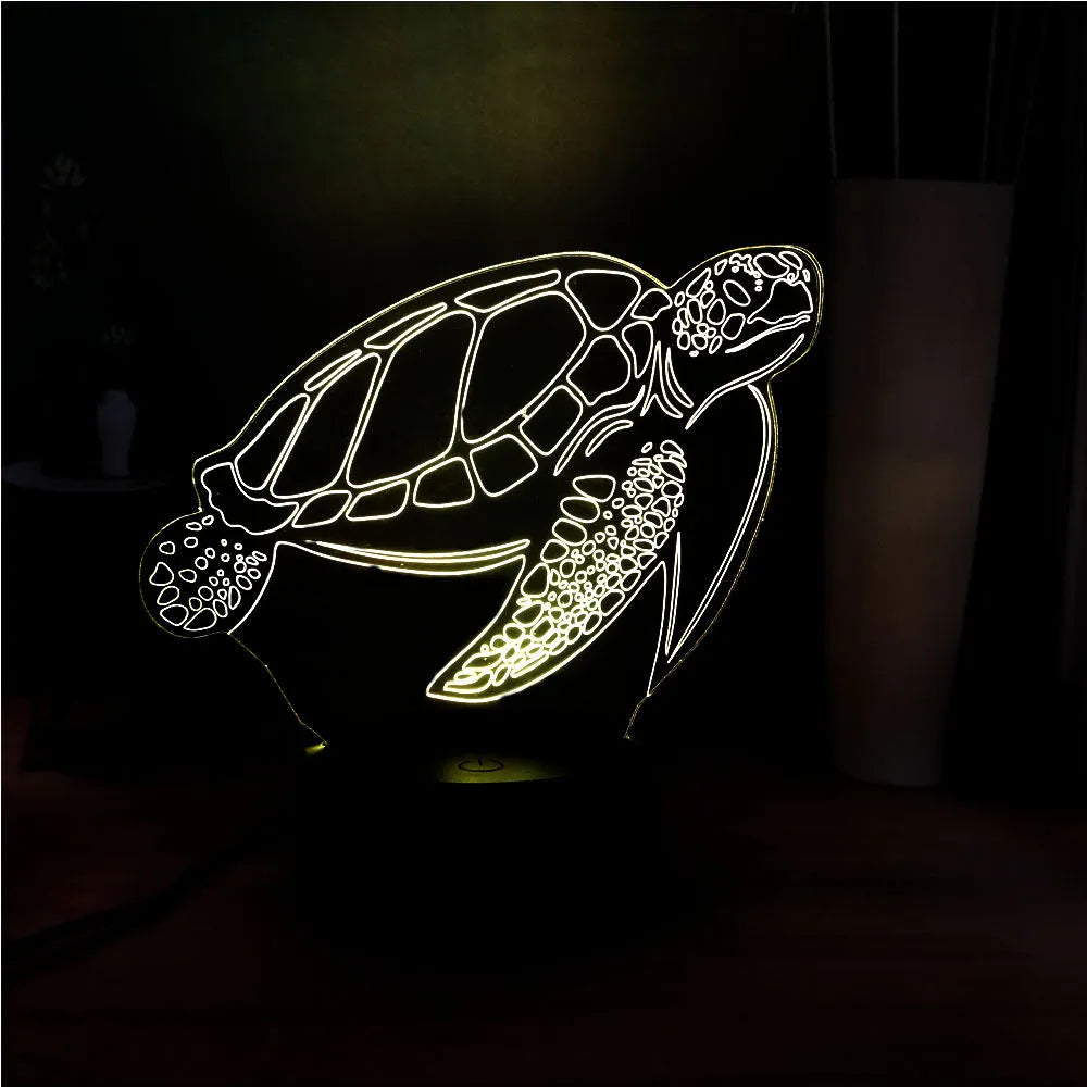 3D clear acrylic turtle-shaped LED night light showing colour changing illumination.