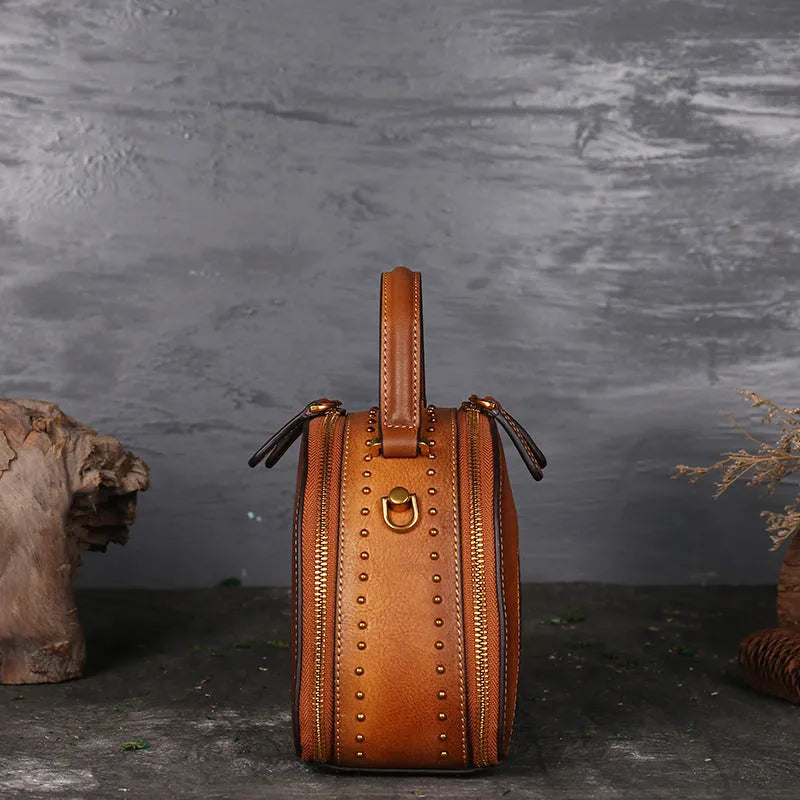 Vintage suede leather handbag in graphite ash showing interior ID, phone, and zipper pockets.