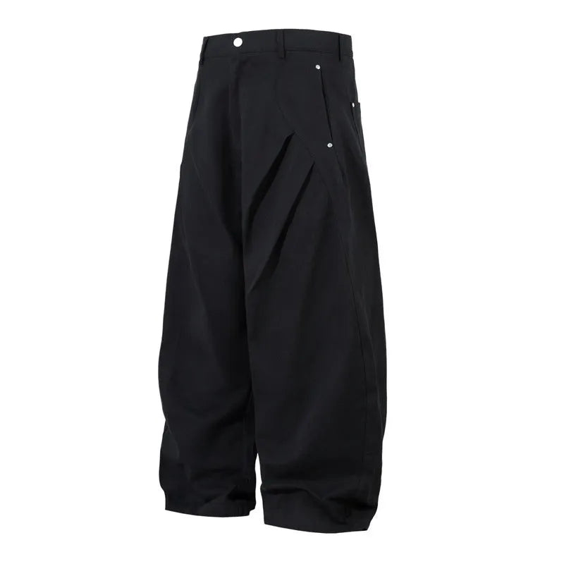 Men's black pleated casual trousers with a loose wide-leg fit and elasticated mid-waist.