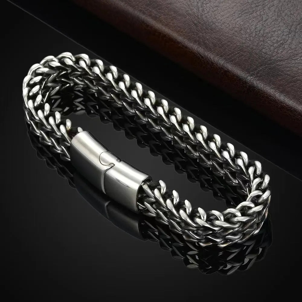 Silver titanium steel men's geometric hip hop bracelet shown on a wrist.