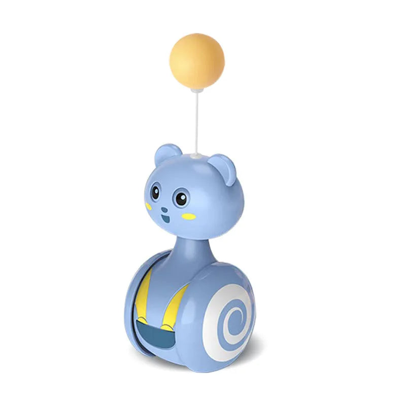Pink and blue cat interactive toy with feather wand and rolling ball on wooden floor