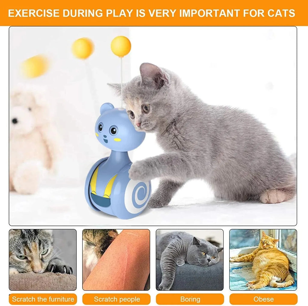 Pink and blue cat interactive toy with feather wand and rolling ball on wooden floor