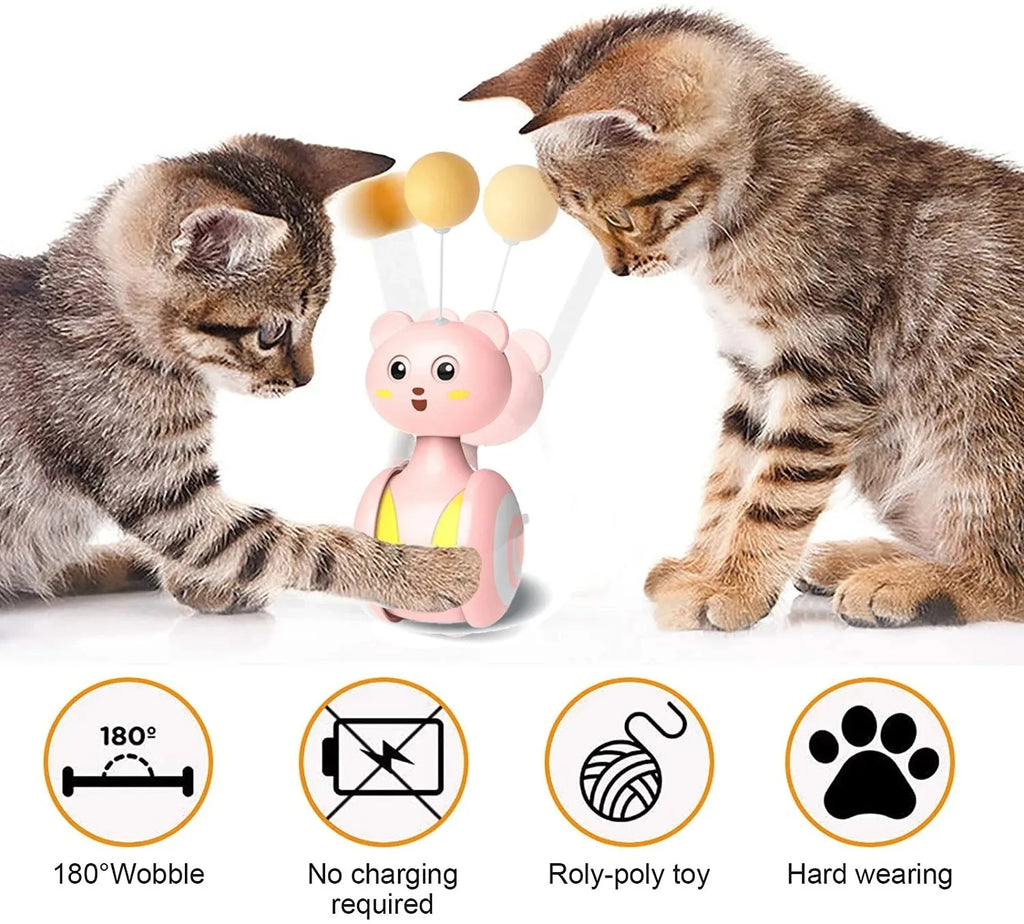 Pink and blue cat interactive toy with feather wand and rolling ball on wooden floor