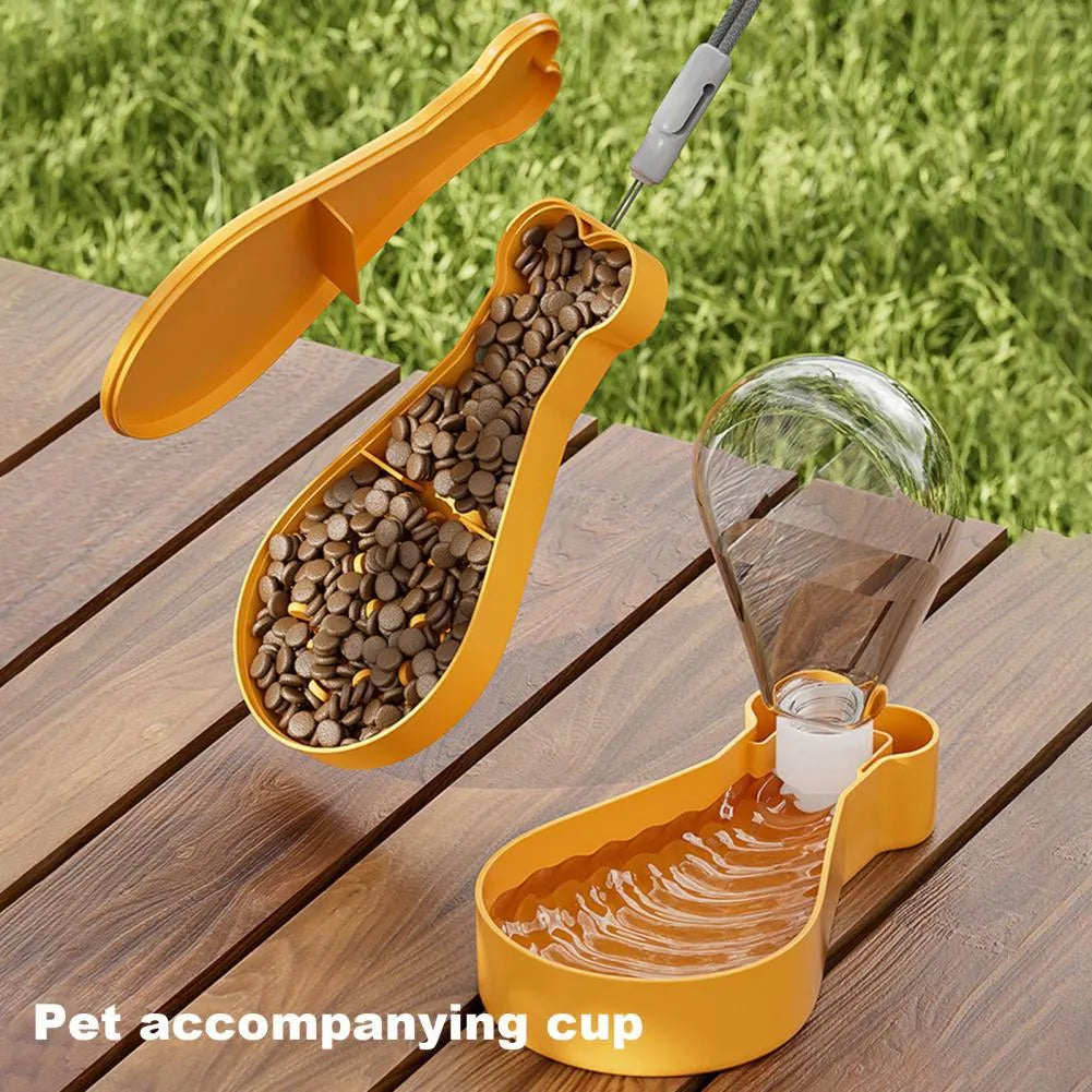 Orange and white portable pet water feeder showing water bottle and food container compartments with carrying sling