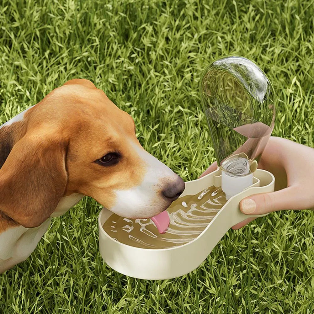 Orange and white portable pet water feeder showing water bottle and food container compartments with carrying sling
