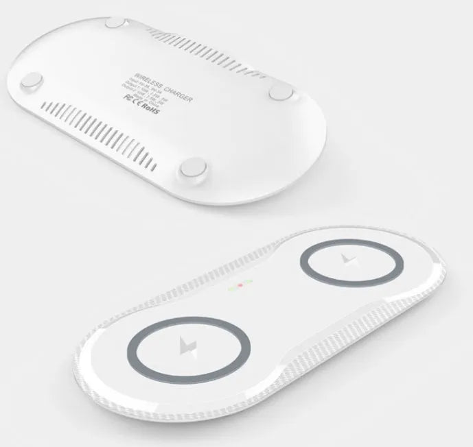 Black and white dual wireless charging pad with two smartphone charging surfaces and anti-slip silicone base