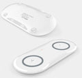 Black and white dual wireless charging pad with two smartphone charging surfaces and anti-slip silicone base