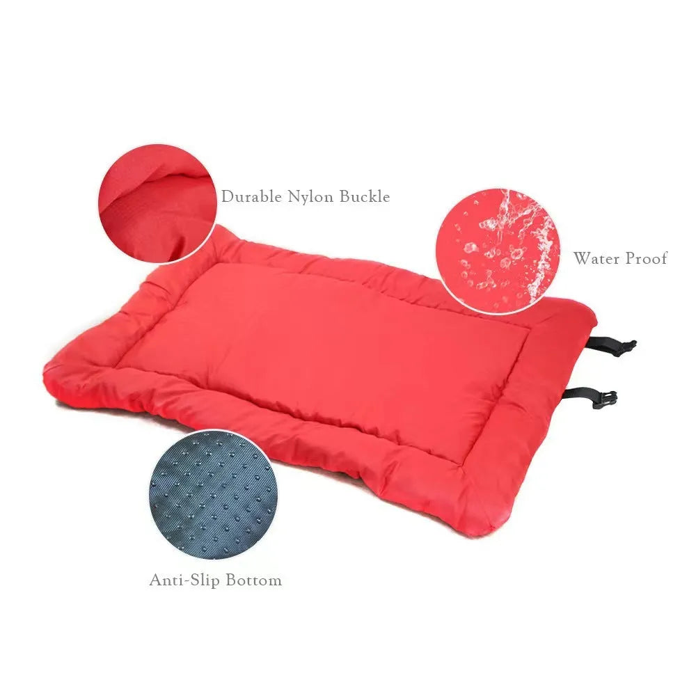 Blue foldable outdoor dog bed showing folded size next to unfolded mat on grass