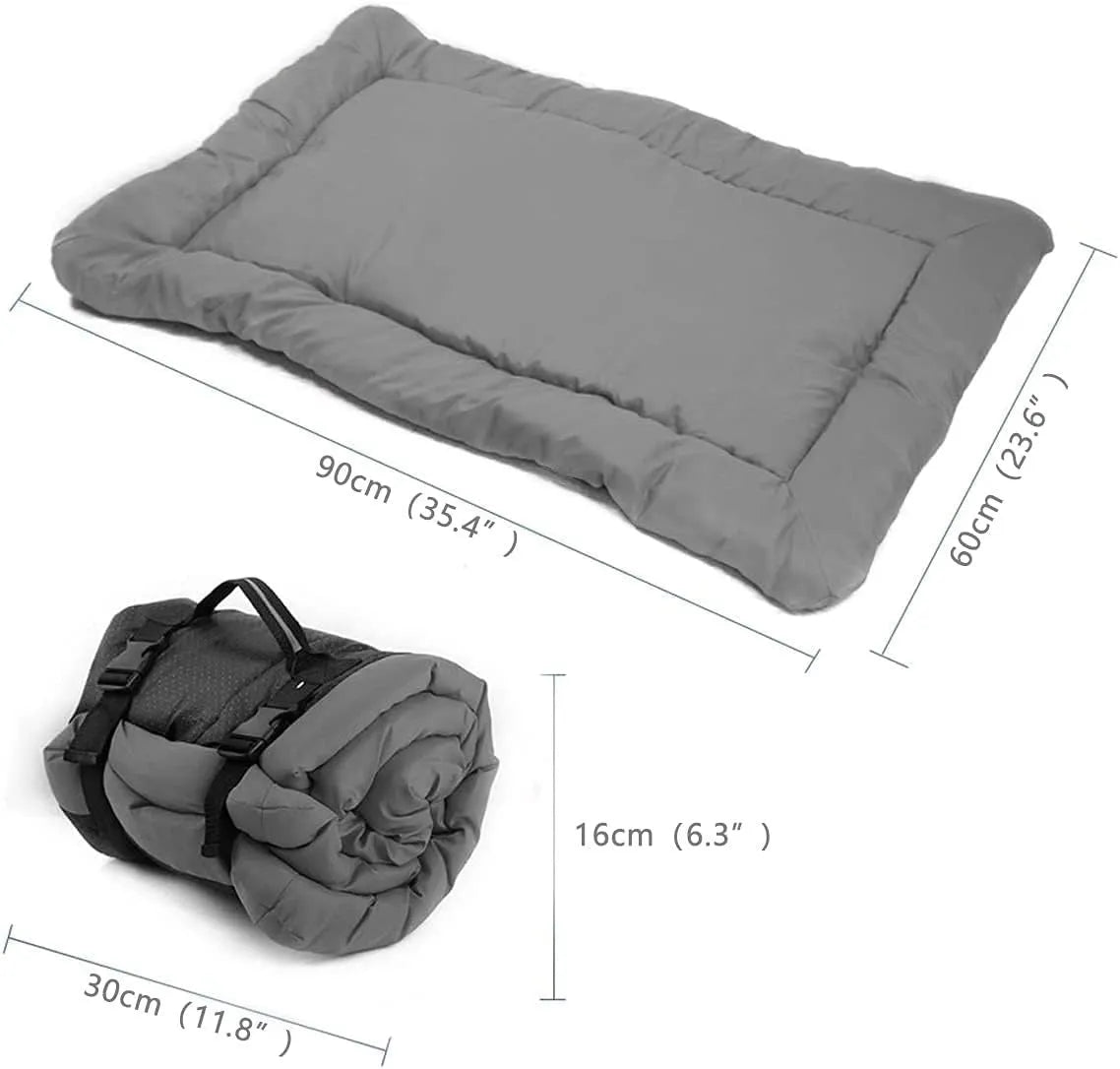 Blue foldable outdoor dog bed showing folded size next to unfolded mat on grass