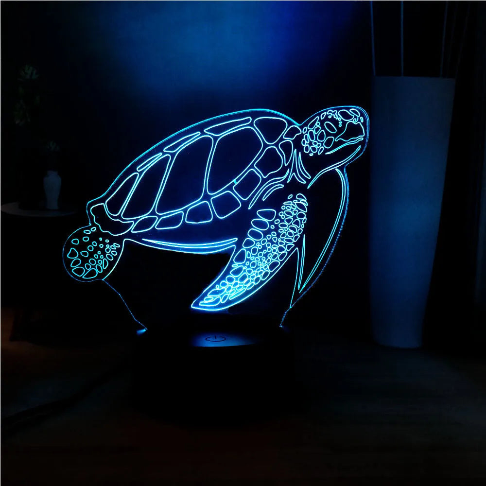 3D clear acrylic turtle-shaped LED night light showing colour changing illumination.