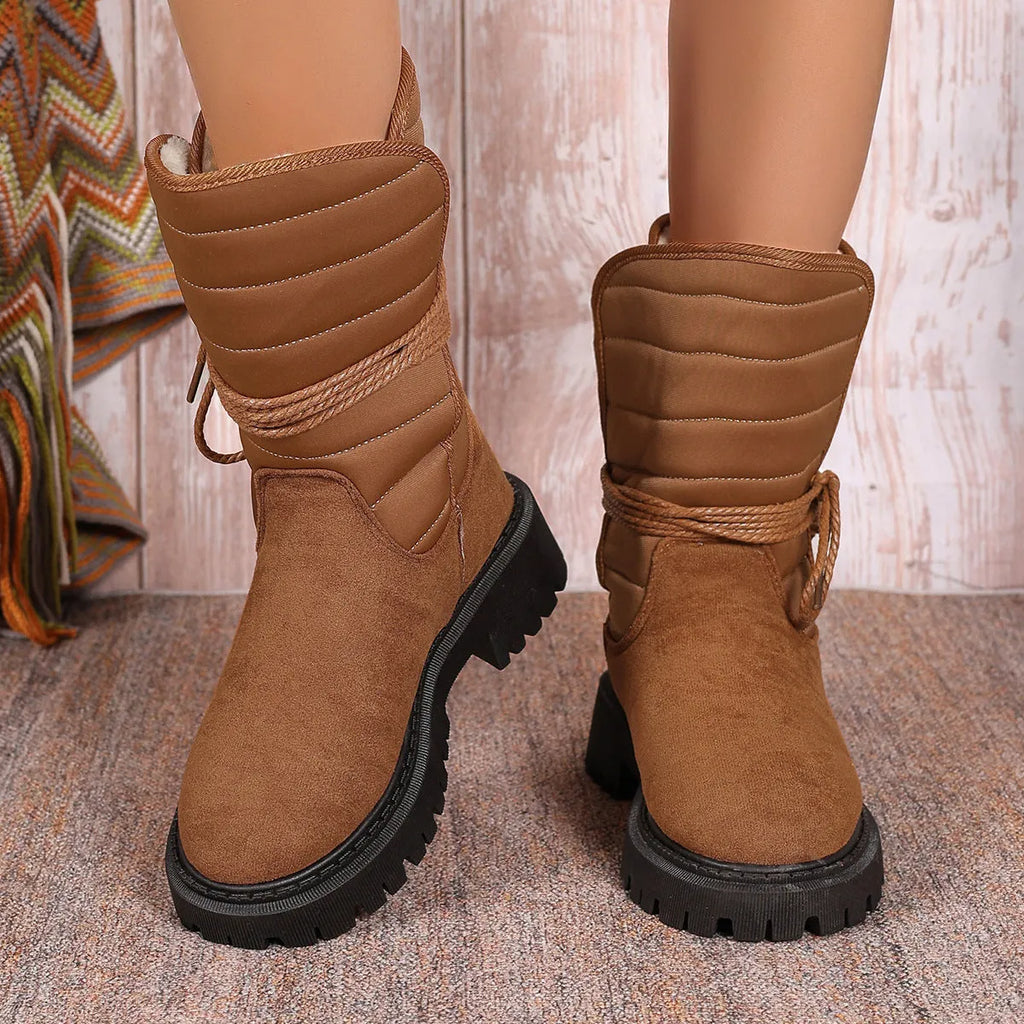 Women's chunky heel snow boots in black with suede upper and lace-up design