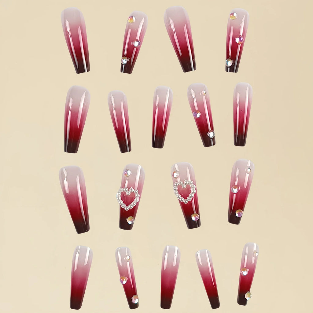 Wine red gradient fake nail tips with a pearl heart and plaid design in a long ballet shape.
