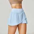 Women's solid colour quick-dry nylon sports shorts with stretch lining on a mannequin.