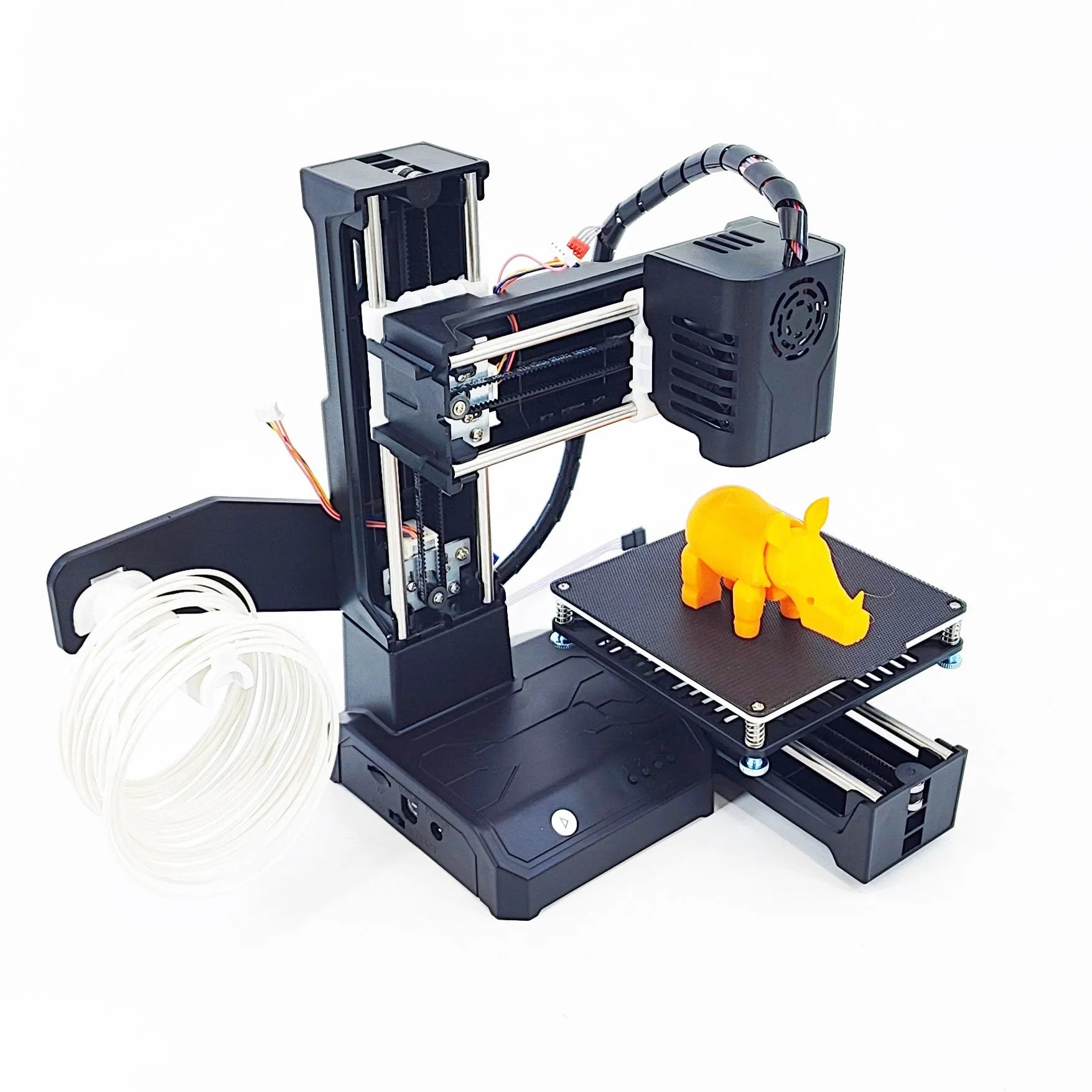 K9 Mini desktop 3D printer on a table next to a small printed PLA model.