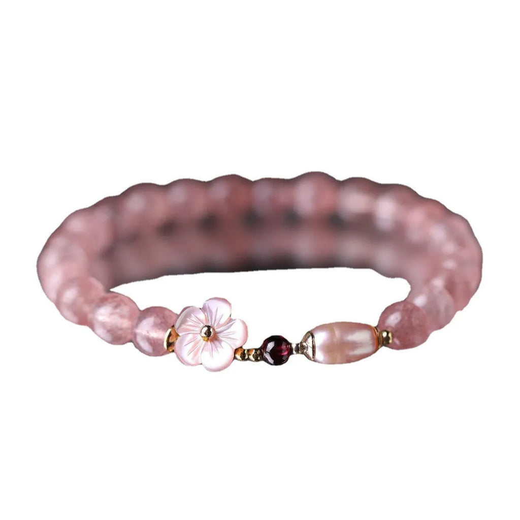 Crystal floral bracelet with strawberry quartz peach blossom colour on wrist