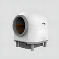 White automatic enclosed cat litter box with dimensions 556mm by 512mm by 590mm.