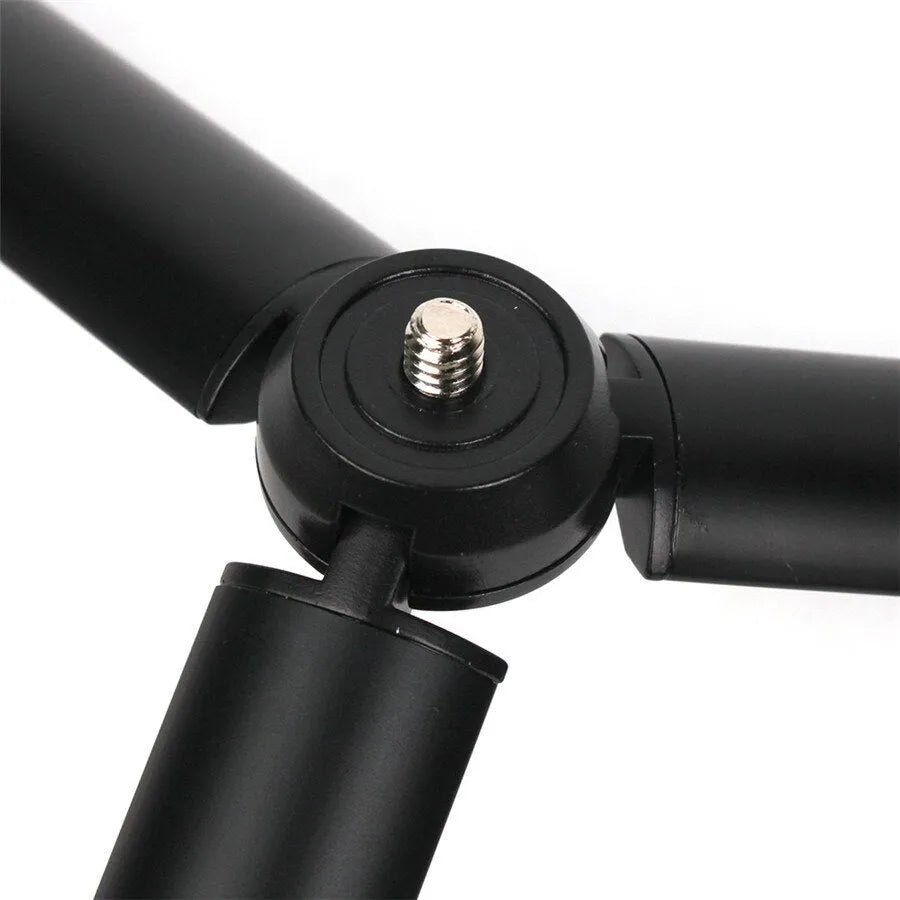 Black aluminium alloy PTZ mobile phone tripod stabiliser mounted with an iPhone.