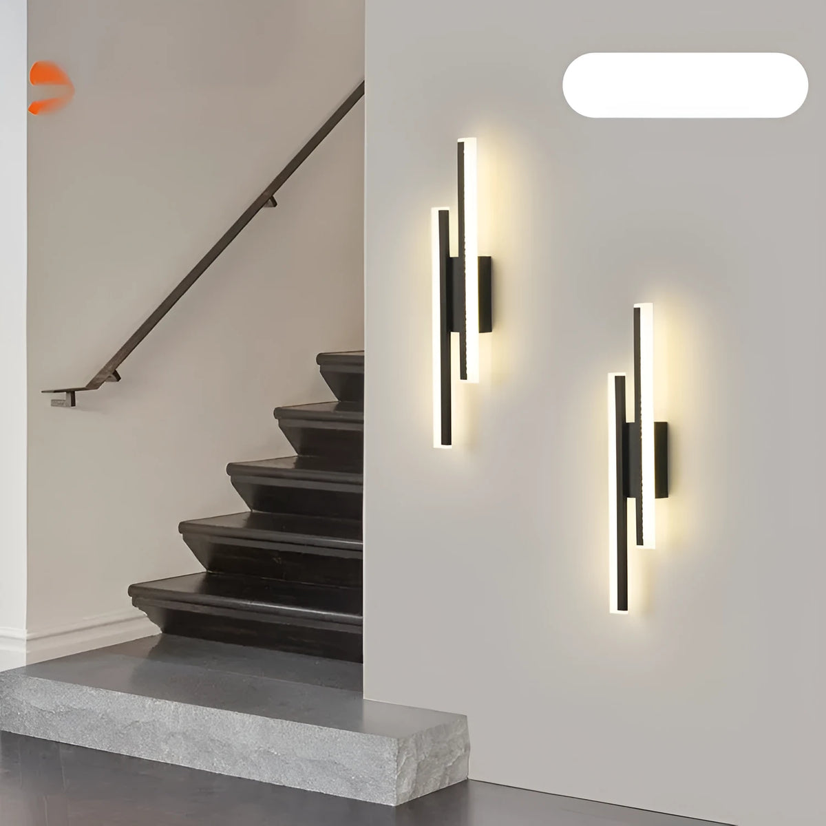 Modern gold and white 500mm double line wall lamp on a plain wall.