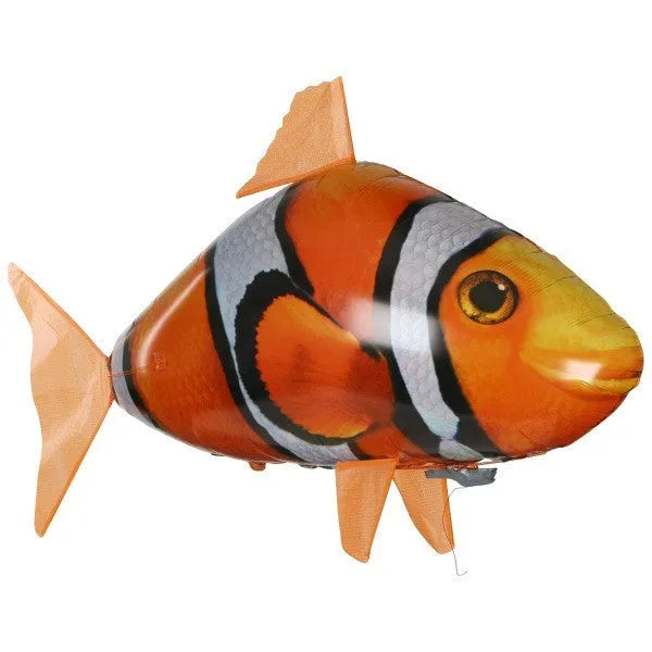 Large remote control shark helium balloon flying indoors with handheld infrared controller.