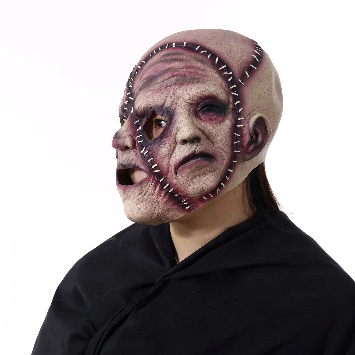 Three-sided grimace horror mask showing realistic facial texture made from natural latex