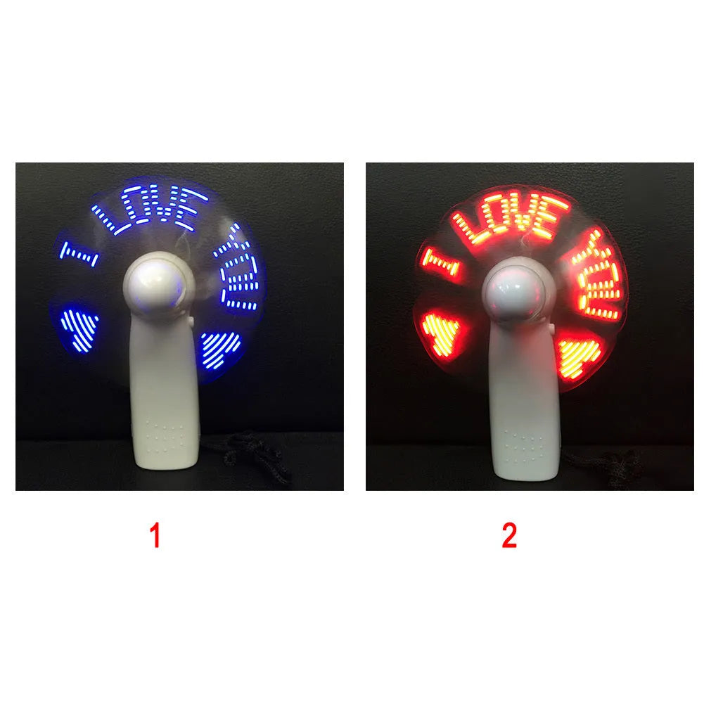 White handheld mini fan showing blue and red LED lights forming a heart and 'I love you' message.