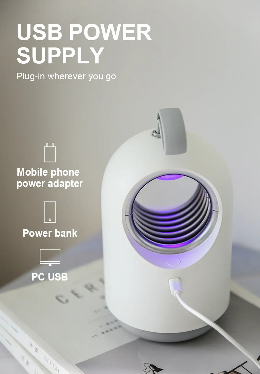 Blue and white indoor mosquito killer lamp with UV light ring, suction vents, and a silicone carry handle.