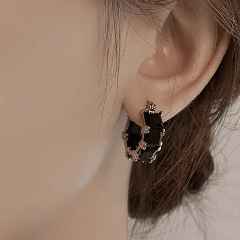 Geometric U-shaped women's earrings with round zircon crystals in gold plating
