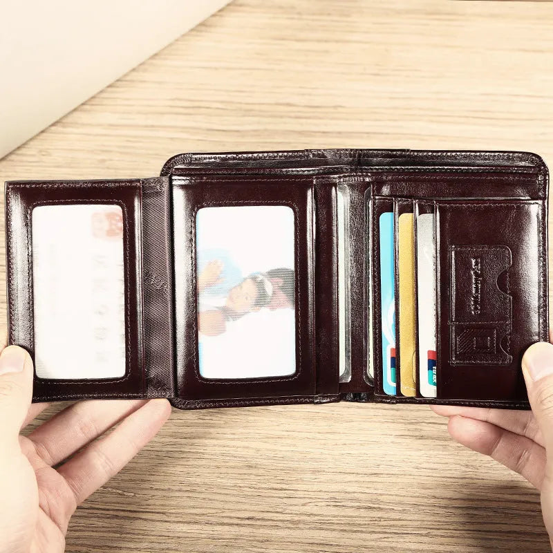 Men's leather wallet open showing card slots, coin pocket, photo window, and document holder in black or brown