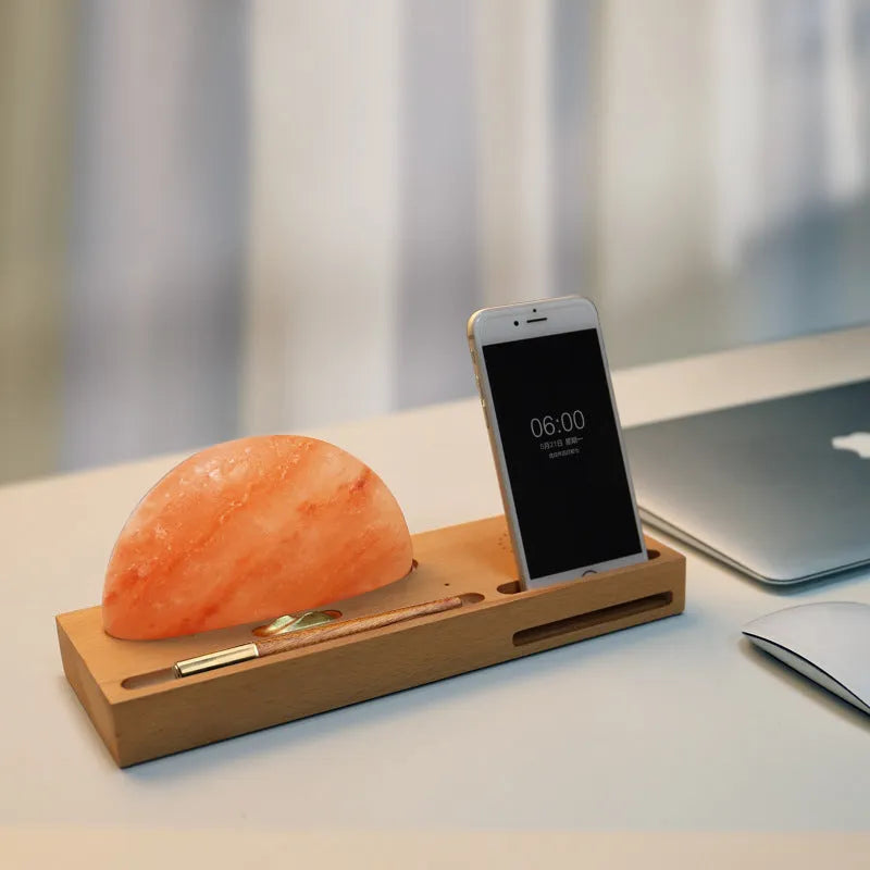 Sunrise Oriental wooden base salt lamp with wireless phone charging pad on top.