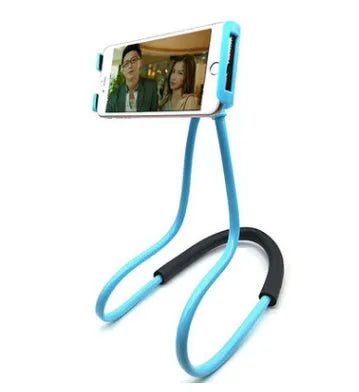 White universal phone holder with 360-degree rotating clamp and flexible neck strap on a table.