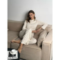 White women's floral print bell sleeve top and wide leg pants loungewear suit set