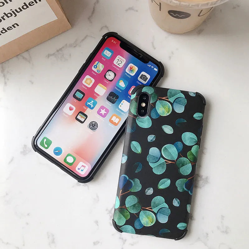 Black silicone phone case with a leaf design for various iPhone models.