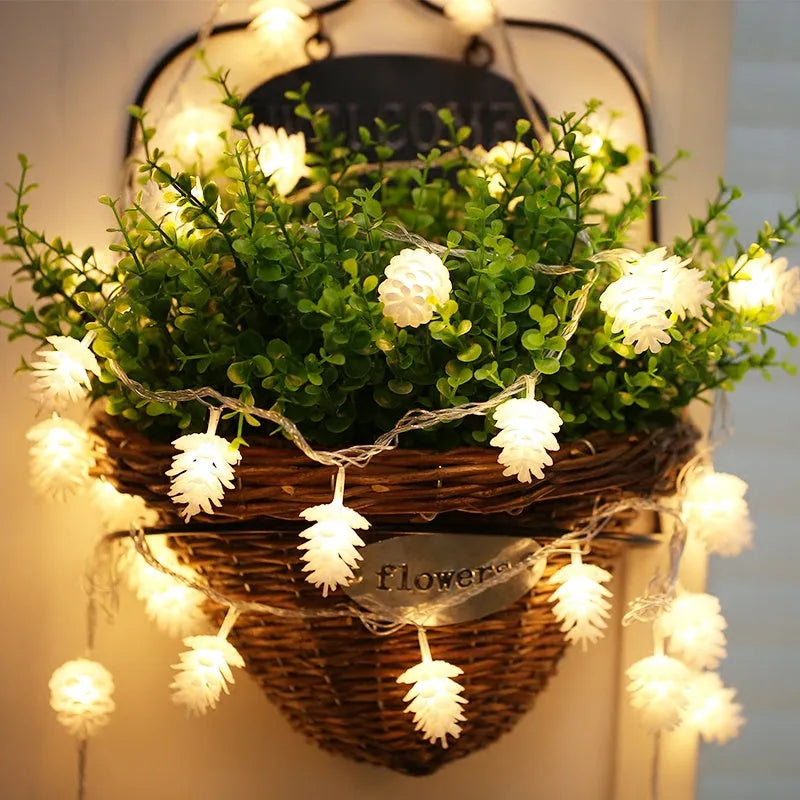 Warm white LED pine cone decorative light string powered by AA batteries