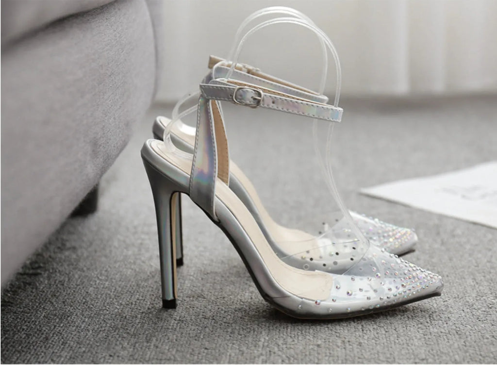 Women's pointed toe diamond sandals with stiletto heel and strappy PVC upper.