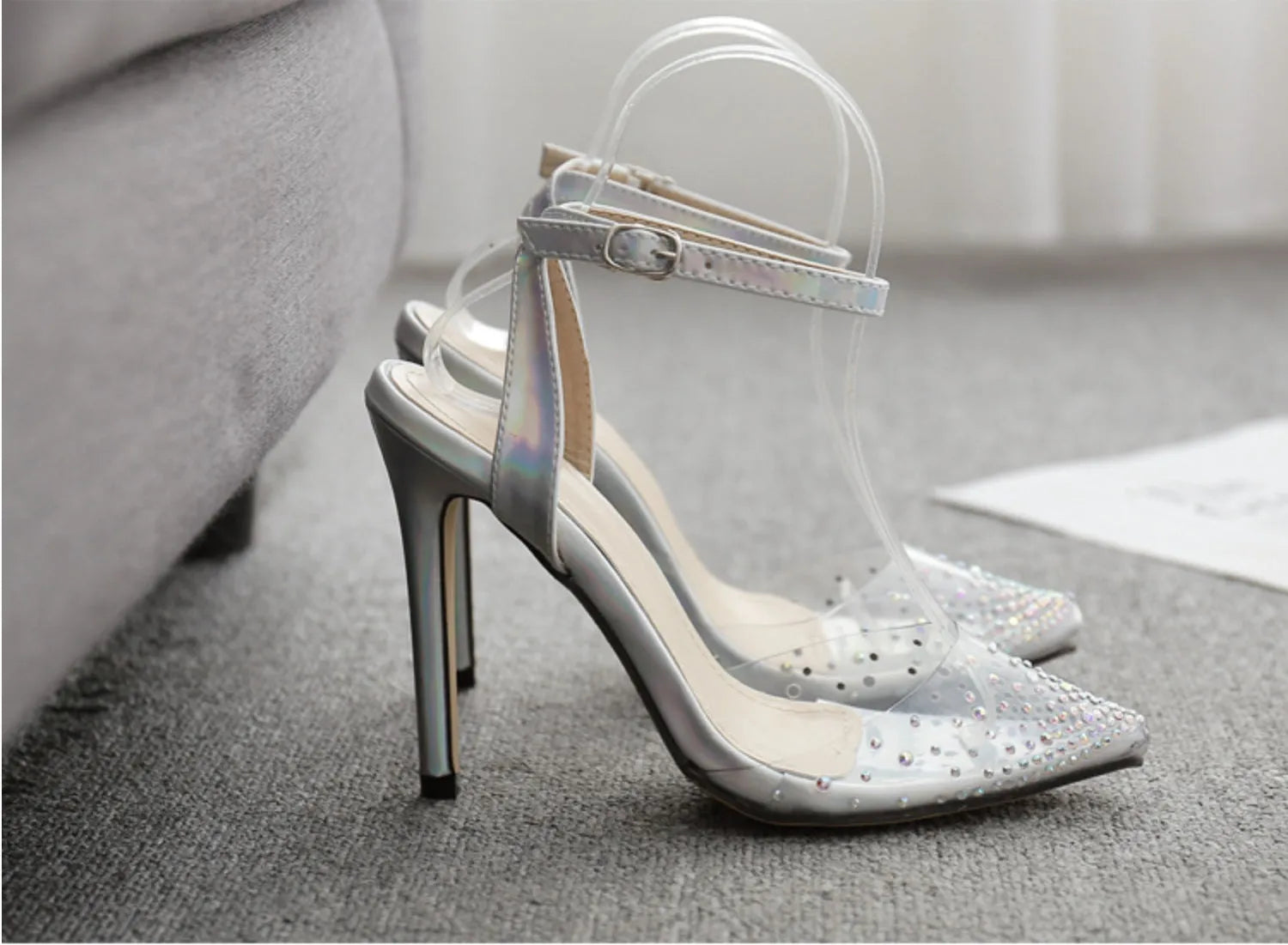Women's pointed toe diamond sandals with stiletto heel and strappy PVC upper.