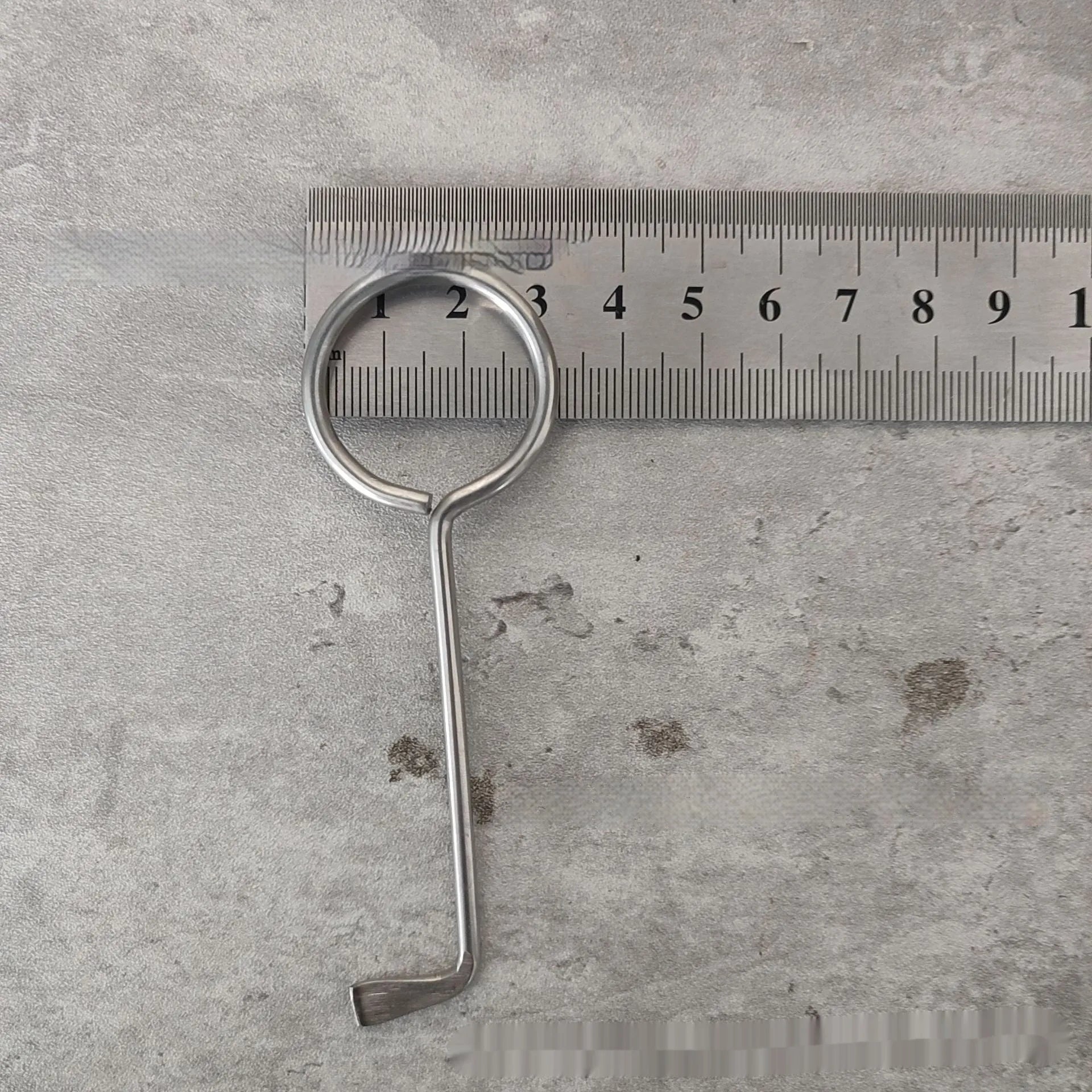 Two alloy wrench tools from a portable family maintenance set on a plain background.