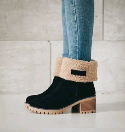 Women's black suede mid-calf snow boots with a round toe and flat low heel.
