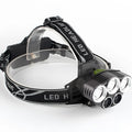 Outdoor head torch with adjustable strap and LED light providing long-range beam for camping