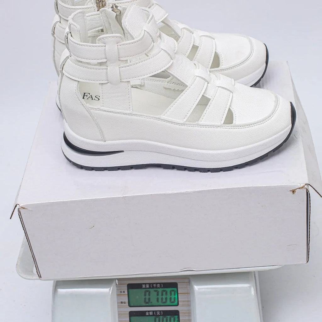 Women's black hollow-out platform sandals with round toe and Velcro strap fastening.