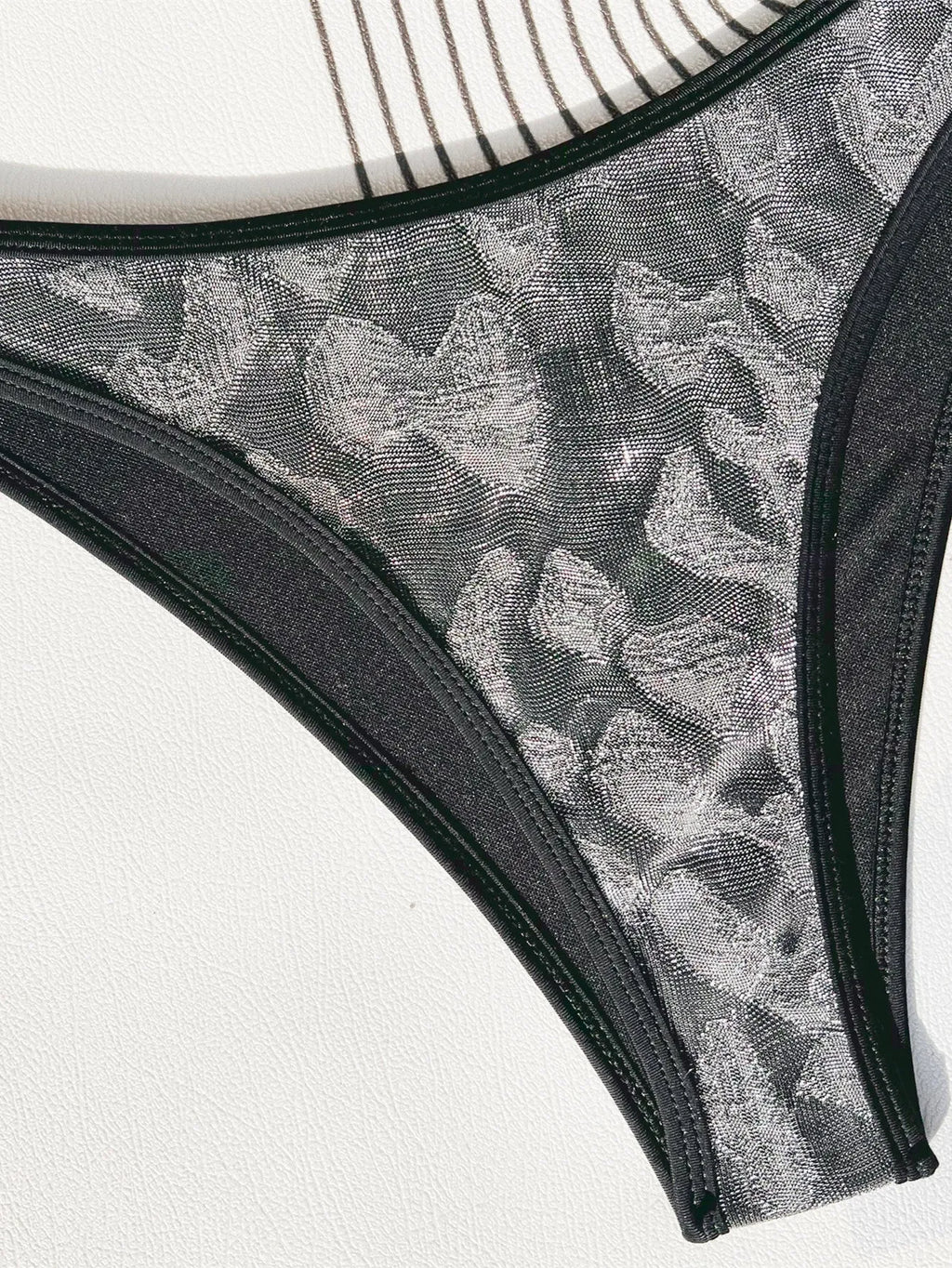 Black polyester women's bikini swimsuit with strap design for swimming
