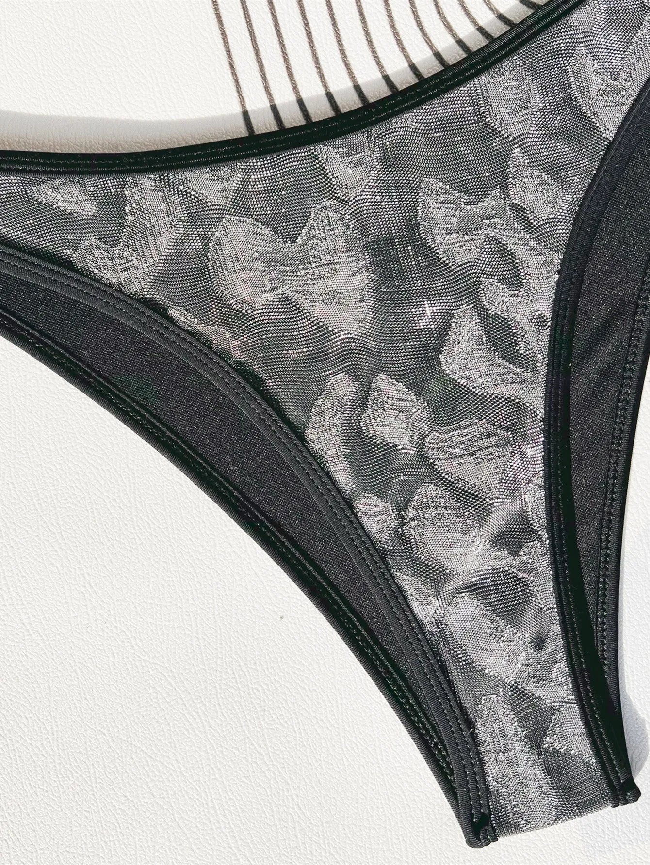 Black polyester women's bikini swimsuit with strap design for swimming