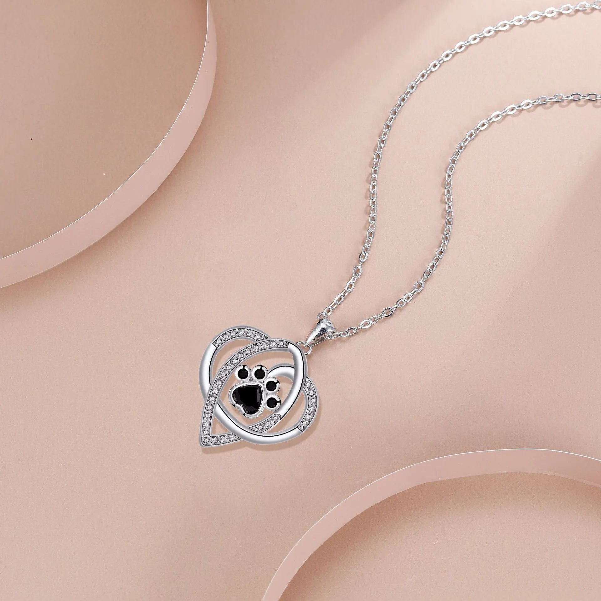 Women's copper necklace with dog paw print pendant and cross chain design