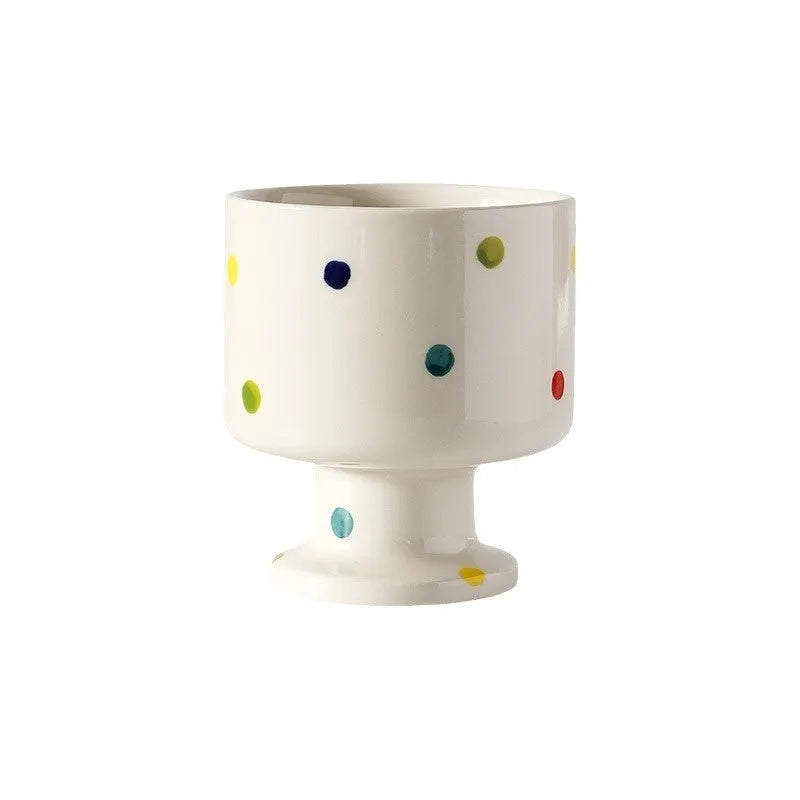 Irregular shaped hand-pinched ceramic mug in solid colour showing unique contours and modern design