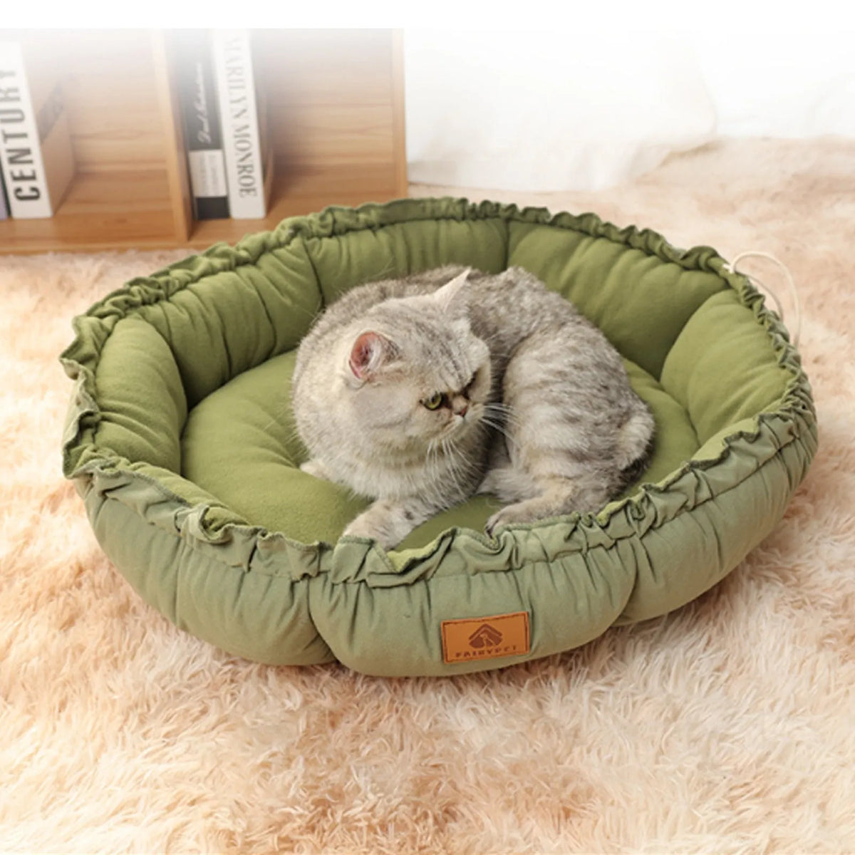 Grey reversible donut cat bed shown in both its donut shape and flipped over to its flat pad side.