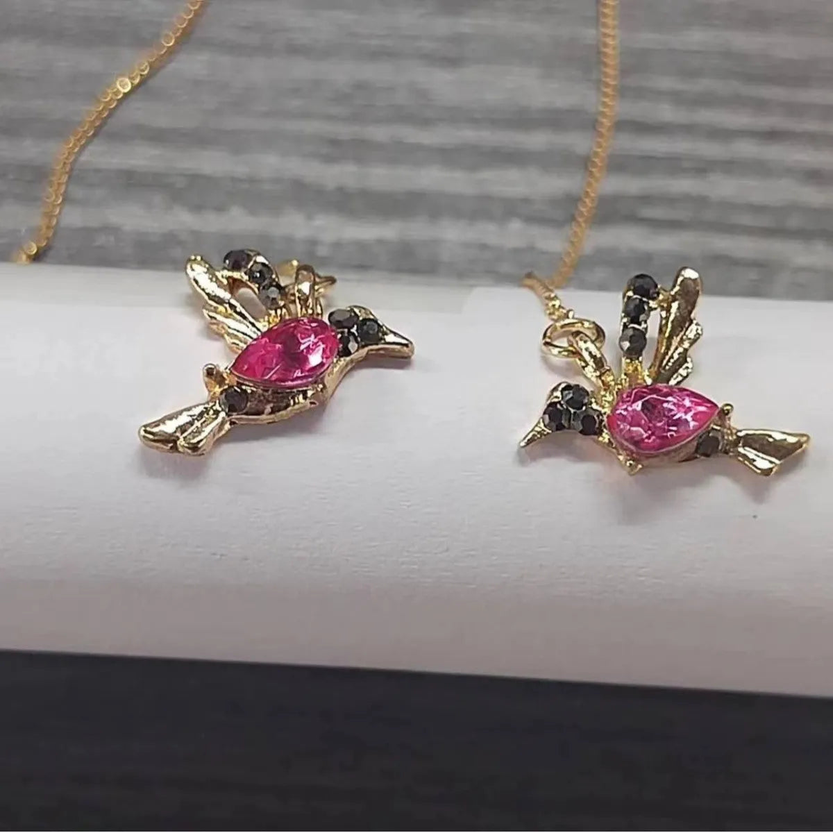 Long style bird hanging earrings with mixed zirconium wings in electroplated alloy construction